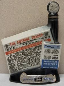 lot 42 image: Vintage The Antique Trader News Paper Jim Beam Whiskey Bottle  Empty  (View Photos)