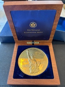 lot 1 image: 15 Ounce 22K Gold 1976 Bicentennial Medallion Number 137 Buyer Premium Caps at $1500