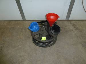 lot 557 image: Hose Reel & Funnels