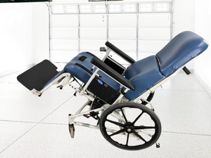lot 14 image: MSRP $2500 Invacare HTR Tilt & Full Recline LTC Wheelchair - In Great Working Condition