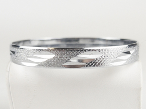 Etched Textured Silver Tone Base Metal Bangle.