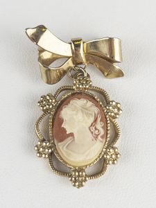 Vintage Cameo With Bow Gold Tone Base Metal Brooch .
