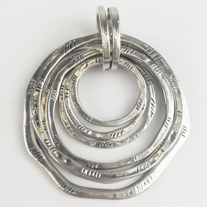 Textured Circles silver tone base metal pendant.