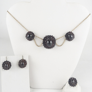 Set of three Bohemian Rhinestone Garnet Gold Tone Base Metal Festoon Necklace, Screw-Back Earrings, & Ring Set. . Size 6.