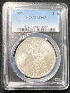 lot 63 image: 1886 US MORGAN SILVER DOLLAR PCGS MS63