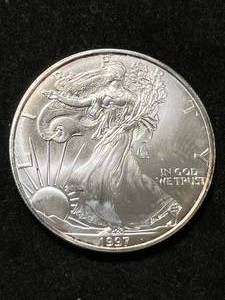 lot 112 image: 1997 AMERICAN SILVER EAGLE 1 TROY OZ .999 FINE SILVER