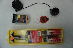 lot 55 image: Outers shotgun cleaning kit, bore snake and scope caps