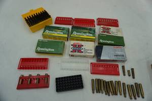 lot 103 image: Reloading brass and bullet holdersstands