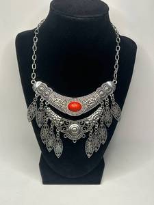 Tribal-Inspired Silver Tone Necklace with Ornate Red Stone