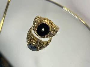 Gold Ring with Black Stone and Intricate Details