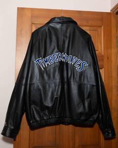 lot 14 image: Wilsons Leather XL Timberwolves Leather Jacket with Chevrolet Embroidery