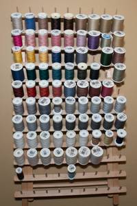 lot 34 image: Wall Hanging Spool of Thread