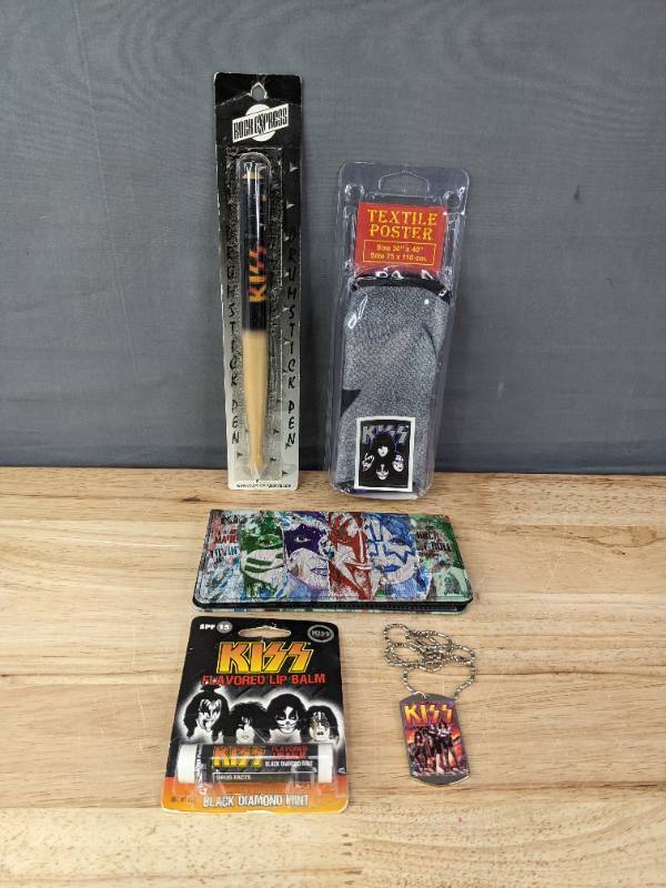 lot 194 image: KISS Drumstick Pen, Lip Balm, Necklace, Wallet and Textile Poster 30 x 40 K