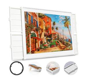 lot 132 image: New 1500 Pieces Rotating Plastic Puzzle Board with Drawers and Cover B