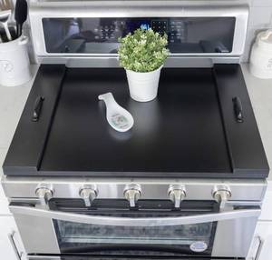 lot 135 image: New Noodle Board Stove Covers with Handles $79.99 Retail B