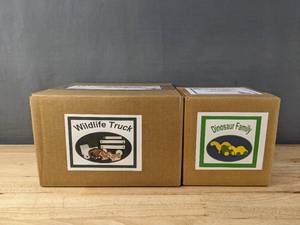 lot 224 image: Brand New Mugwups Toys Wildlife Truck and Dinosaur Family B
