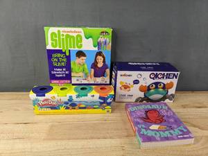 lot 237 image: Brand New Kids Books and Toys Nickelodeon Slime Kit, Play-Doh, Dinosaur vs. Mommy by Bob Shea, and Qichen Crab Toy B
