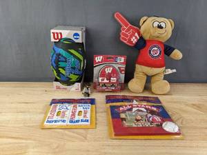 lot 247 image: New Toys - Wilson NCAA Bronze Series Junior Football, Washington Nationals MLB Stuffed Bear, All-Star Decor Photo Frame, University of Wisconsin Toy Train Engine, NHL Playmobile Hockey Referee B