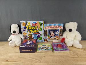 lot 225 image: New Kids Toys and Books Peanuts Snoopy Stuffy, Twist & Turn Shapes, Mickey and Friends Magical Treats, Magic Trick Play Set, Dinosaur vs. Mommy Book and More B