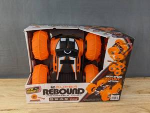 lot 44F image: Brand New New Bright (116) Super Rebound Battery Remote Control Orange Stunt Vehicle B