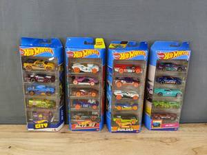lot 250 image: 4 Brand New Hot Wheels 5-Packs - Hot Wheels City, Hot Wheels Action, Hot Wheels Track Builder, Hot Wheels HW Drift B