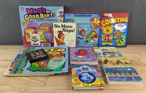 lot 238A image: New Assortment of Kids Games and Books Whos My Good Boy 5 Progressive Puzzles, Graphic Novel Counting, Here Comes the Fit-It Force, Dinosaur Vs. Mommy, Snowmen at Night, No More Naps, Blues Clues & You, Crayons, Etc. B