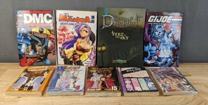 lot 119F image: Brand New Assortment of 9 Books DMC, Lets Draw Manga, Penny Dreadful, GI Joe Volume 17, Kill Me Kiss Me Volume 2, Battle Mixens, Animal Academy, Yu-Gi-Oh GX Volume 5 and Shaman King Volume 15 N
