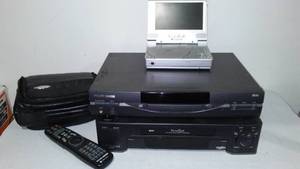 lot 391 image: Philips Magnavox DVD Player, Mitsubi VHS Player And Polaroid Player.