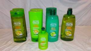 lot 572 image: Garnier Fructis Sleek And Shine and Grow Strong Shampoo and Conditioner.