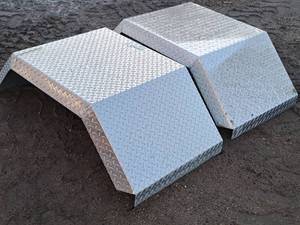 lot 197 image: Lot of (2) Diamond-plate Tire Fenders 27x50x15-12