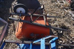 lot 31 image: Orange Wheel Barrel