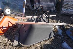 lot 32 image: Green Wheel Barrel