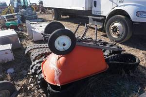 lot 35 image: Orange Dual Wheel Wheel Barrel