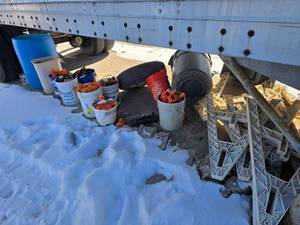 lot 37 image: (9) Nine buckets of misc parts and contents under trailer