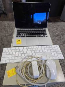 lot 128 image: Macbook with charger, mouse and keyboard