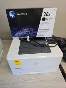 lot 148 image: HP Laserjet Pro M402n and new ink cartridge