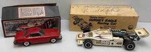 lot 32 image: Collectible Jim Beam Bobby Unser Gurney Eagle & 1974 Mercedes Benz Decanters  In Original Boxes (EMPTY)