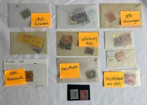 lot 333 image: Small Bundle of Stamps from Nicaragua, Peru, Columbia, Antigua, Barbados, Venezuela, Uruguay, Philippines, and Prince Edward Island dating back to 1861