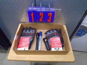 lot 123 image: Flat of gloves & flashlights. As shown.