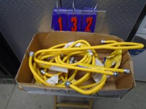 lot 132 image: Approx 6 flex gas lines. As shown.