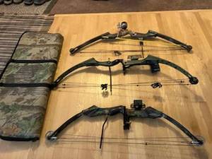lot 101 image: Qty of 3 compound bows. 1 with fishing attachment & 1 case. As shown.
