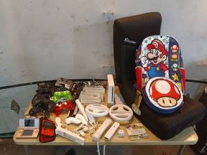 lot 83 image: Mixed Gaming Equipment Bundle Featuring Wii Console and Controllers