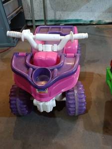 lot 91 image: Kids Pink and Purple Ride-On Toy ATV