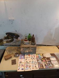 lot 110 image: Assorted Vintage Collectibles Including Stamps, Bottles, and Accessories