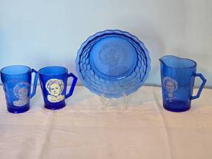 lot 23J image: Commemorative Shirley Temple Etched Cobalt Glass Decor Collection - (4)