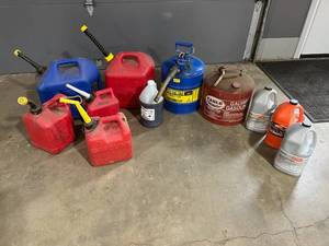 lot 33 image: Nice Lot of Assorted Fuel  Gasoline Cans and Stihl Chain Saw Lubricant