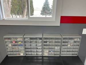 lot 57 image: Four Plastic Hardware Storage Containers Loaded with Goodies