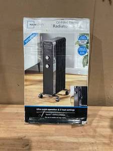 lot 402 image: Mainstays Mechanical Oil Filled Electric Radiator Space Heater
