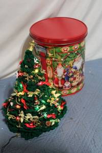 lot 64 image: Decorative Light-Up Crochet Christmas Tree with Vintage-Style Tin