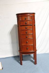 lot 67 image: Tall Wooden Jewelry Armoire with Multiple Drawers and Side Compartments